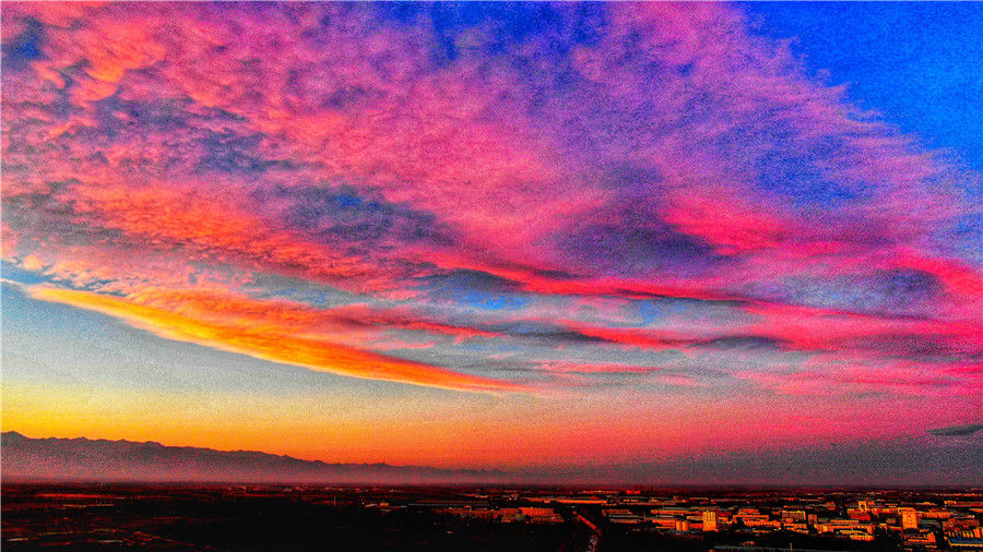 Fotografía de un espléndido atardecer invernal en Yinchuan, en la región autónoma Hui de Ningxia. [Foto por Su Yong/para chinadaily.com.cn]